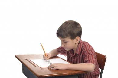 A boy in school about to take a test